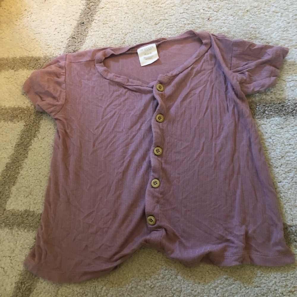 Purple Kate Quinn one piece romper.